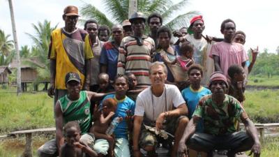 Carl Hoffman in Papua with Asmat tribe