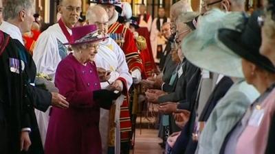 The Queen presenting the specially-minted coins to 176 recipients