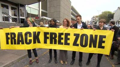 Caroline Lucas and other protesters outside court