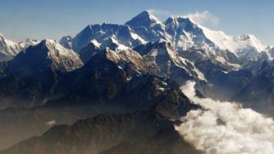 Mount Everest (C), the world's highest peak, and other peaks of the Himalayan range