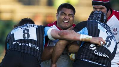 Nick Williams is tackled by two Glasgow players