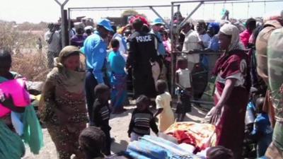 Refugees at camp gates