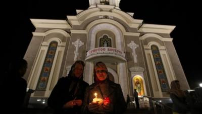 Ukrainian Orthodox worshippers attend a holy liturgy during an Orthodox Easter service in Donetsk