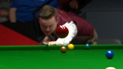 Shaun Murphy makes the red ball fly in to the air after a missed pot