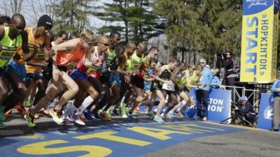 Elite men runners leave the start line