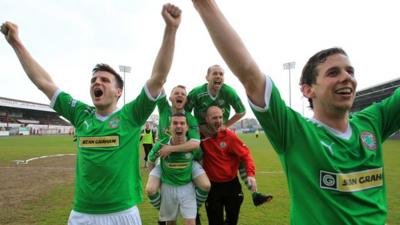 Cliftonville players celebrate retaining the Gibson Cup