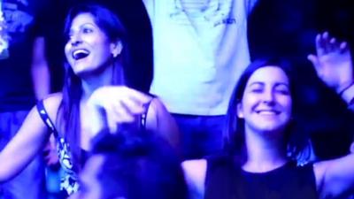 Two Indian women dancing at a night club