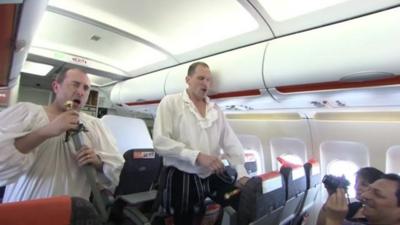 Actors performing on plane
