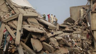 Rescue workers look for trapped garment workers at the collapsed Rana Plaza building in Savar, 30 km (19 miles) outside Dhaka April 26, 2013