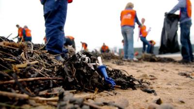 Volunteers cleaning up a beach
