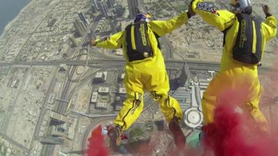 View as sky divers jump from Burj Khalifa