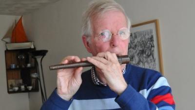 Andrew Fairley with his flute, believed to have been created in the trenches during World War One