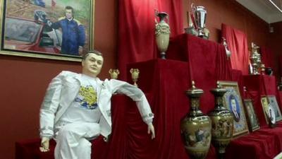 art including Yanukovich doll and portraits