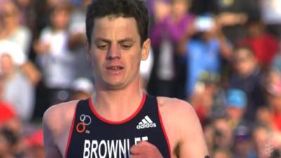 Great Britain's Jonny Brownlee is comfortably beaten by Javier Gomez of Spain at the ITU Triathlon World Series in Cape Town.