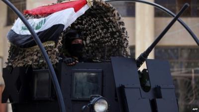 A member of Iraq's anti-terrorism force deployed outside a polling station in central Baghdad, 29 April 2014