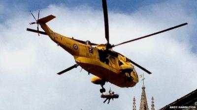 Rescue helicopter above Wells Cathedral