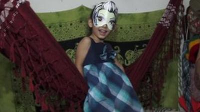 A child plays on a Brazilian squat