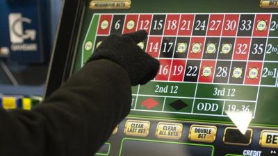 Person on a betting machine