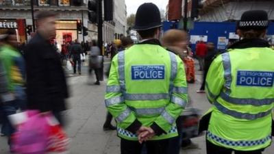 Police patrol Oxford Street, London