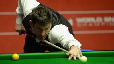 Ronnie O'Sullivan in semi-final action against Barry Hawkins at the World Snooker Championship