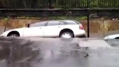Car slips into sinkhole