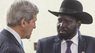 South Sudan's President Salva Kiir, right, listens to U.S. Secretary of State John Kerry