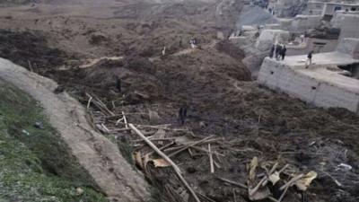 Afghan villagers gather at the site of a landslide at the Argo district in Badakhshan province, May 2, 2014