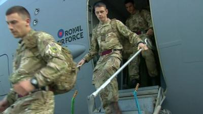 British troops get off military plane