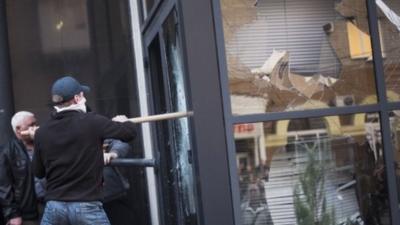 Activists breaking into a building in Donetsk