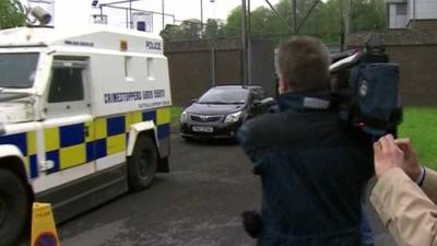 Gerry Adams leaving Antrim PSNI station