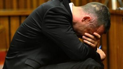 Oscar Pistorius holds head in hands in court on May 5 2014