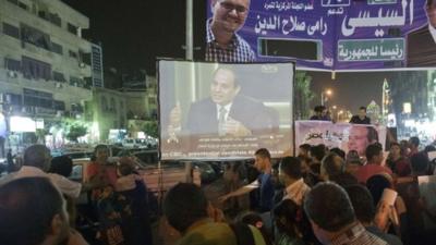 Egyptians watch Abdel Fattah al-Sisi interview on big screen