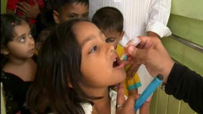 Child being given polio vaccine