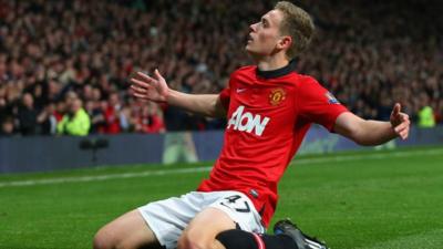 James Wilson celebrates scoring on his debut for Manchester United