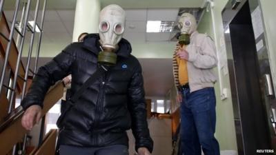 Pro-Russia rebels wearing gas masks