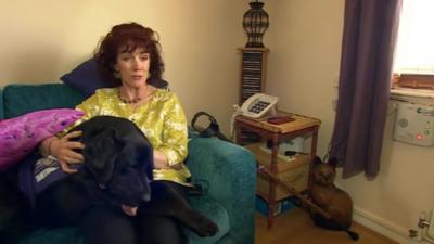 Tricia O'Brien with care dog Barclay