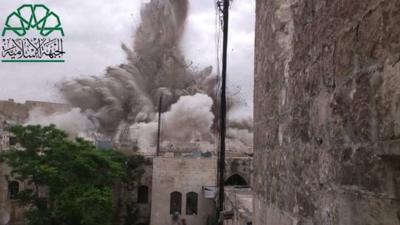 Photograph posted by Liwa al-Tawhid rebel group purportedly showing explosion underneath Carlton Citadel Hotel in Aleppo on 8 May 2014