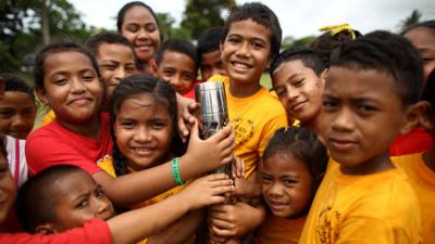 Queen's baton held by children in Tonga