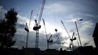 Row of construction cranes in London