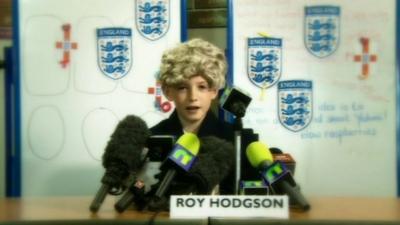 A child posing as Roy Hodgson