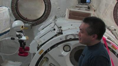 Kirobo and Koichi Wakata talking inside the space station