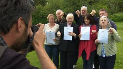 Relatives with Trusted in Care reports having photograph taken