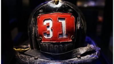 Surviving firefighter Dan Potter's fire helmet, which he used at Ground Zero on September 11, is viewed during a tour the National September 11 Memorial Museum