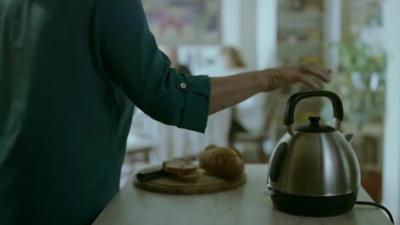 A woman and a kettle