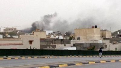 Smoke rises over Libya's parliament buildings in Tripoli