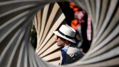 An exhibitor relaxes on his stand at the 2014 Chelsea Flower Show at Royal Hospital Chelsea