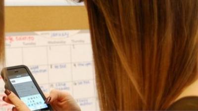 girl looking at smartphone