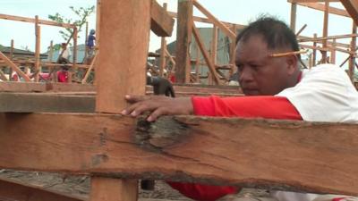 Worker building house in Manila