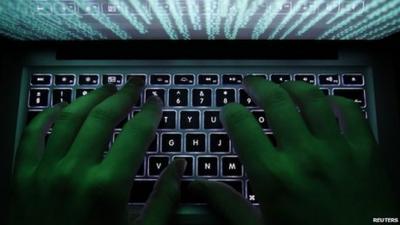 A hacker on a computer