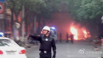 Police near presumed scene of attack in Urumqi (22 May)